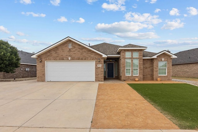403 Mile High Ln, Midland, TX 79706 - view of front of home featuring brick siding, concrete driveway, a front yard, and an attached garage