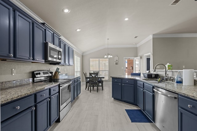 403 Mile High Ln, Midland, TX 79706 - kitchen with appliances with stainless steel finishes, a sink, a chandelier, vaulted ceiling, and crown molding