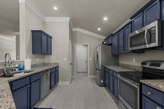 403 Mile High Ln, Midland, TX 79706 - kitchen with appliances with stainless steel finishes, blue cabinets, a sink, light wood finished floors, and light stone countertops