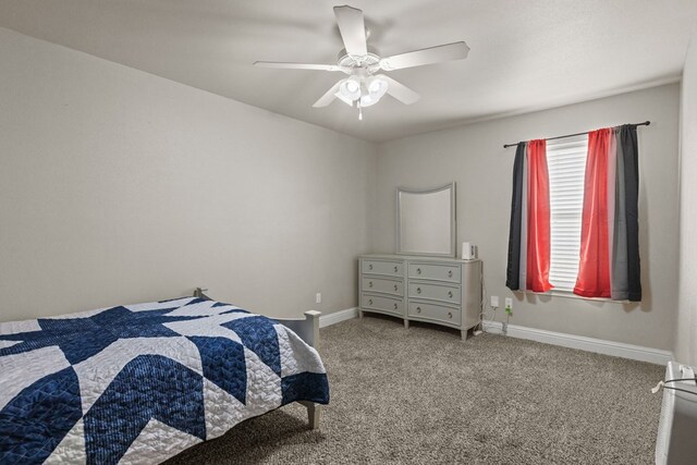 403 Mile High Ln, Midland, TX 79706 - bedroom with carpet flooring, baseboards, and a ceiling fan