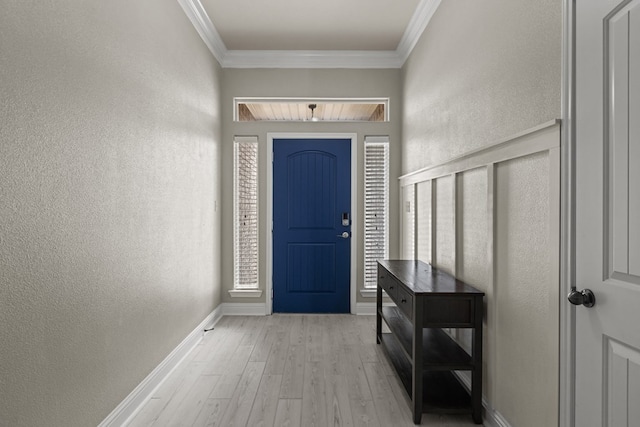 403 Mile High Ln, Midland, TX 79706 - foyer featuring light wood finished floors, ornamental molding, a textured wall, and baseboards