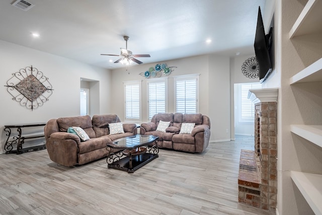 807 Bronco Ct, Midland, TX 79705 - living area with ceiling fan, a fireplace, light wood-style floors, and recessed lighting