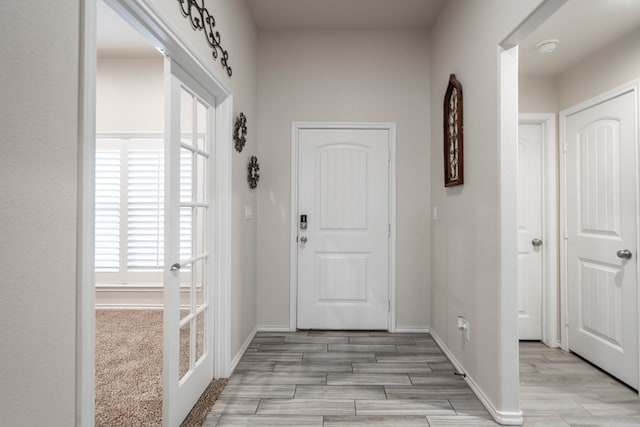 807 Bronco Ct, Midland, TX 79705 - foyer entrance with light wood finished floors and french doors