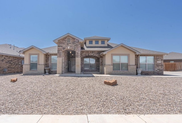 807 Bronco Ct, Midland, TX 79705 - view of front of house with brick siding and roof with shingles