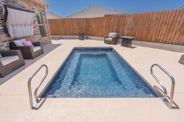 807 Bronco Ct, Midland, TX 79705 - view of swimming pool featuring a fenced backyard and a patio