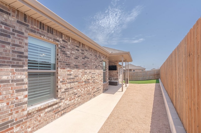 807 Bronco Ct, Midland, TX 79705 - fenced backyard with a patio area