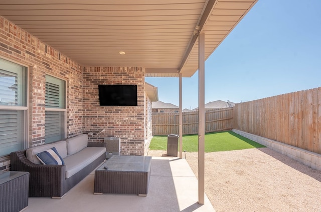 807 Bronco Ct, Midland, TX 79705 - fenced backyard featuring a patio area and an outdoor living space