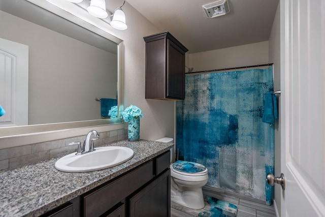 807 Bronco Ct, Midland, TX 79705 - full bathroom featuring vanity, backsplash, and a shower with shower curtain