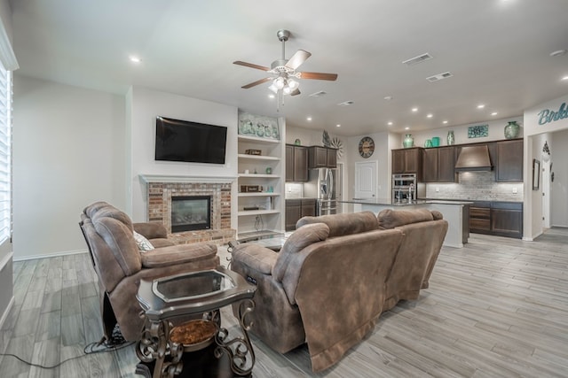 807 Bronco Ct, Midland, TX 79705 - living area with a ceiling fan, light wood-type flooring, recessed lighting, and a fireplace
