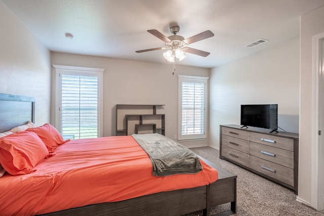 807 Bronco Ct, Midland, TX 79705 - bedroom with light carpet, multiple windows, and ceiling fan