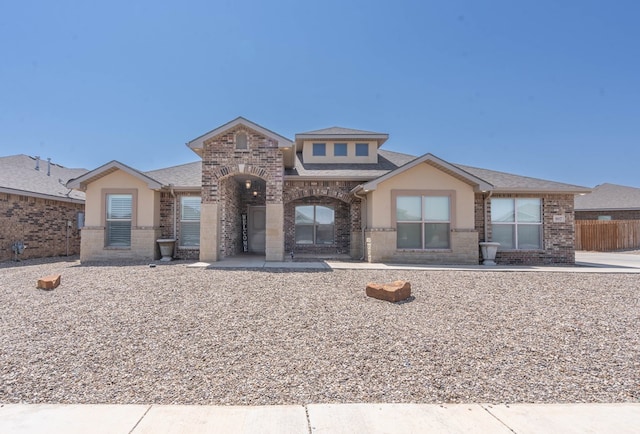 807 Bronco Ct, Midland, TX 79705 - view of front of home featuring brick siding and a shingled roof