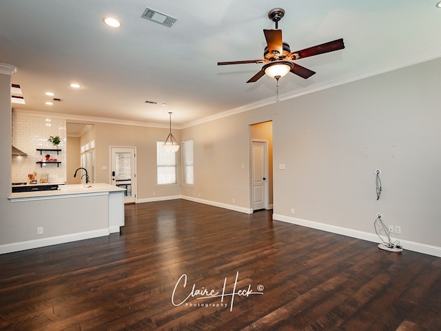 5305 Wimberley Spring Ct, Midland, TX 79707 - unfurnished living room with a ceiling fan, dark wood-style flooring, crown molding, baseboards, and recessed lighting