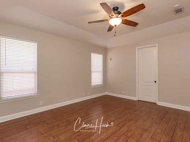 5305 Wimberley Spring Ct, Midland, TX 79707 - empty room featuring a ceiling fan, dark wood-type flooring, and healthy amount of natural light