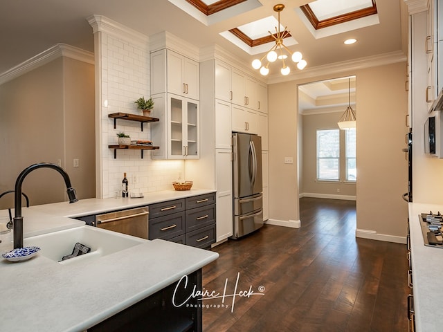 5305 Wimberley Spring Ct, Midland, TX 79707 - kitchen featuring stainless steel appliances, ornamental molding, baseboards, white cabinets, and hanging light fixtures