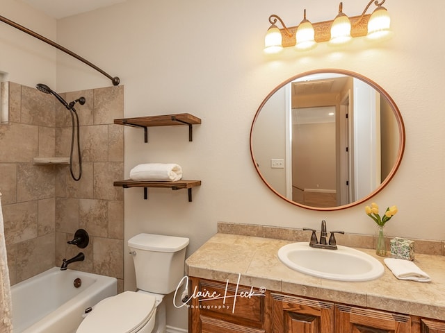 full bath with  shower combination, vanity, and toilet