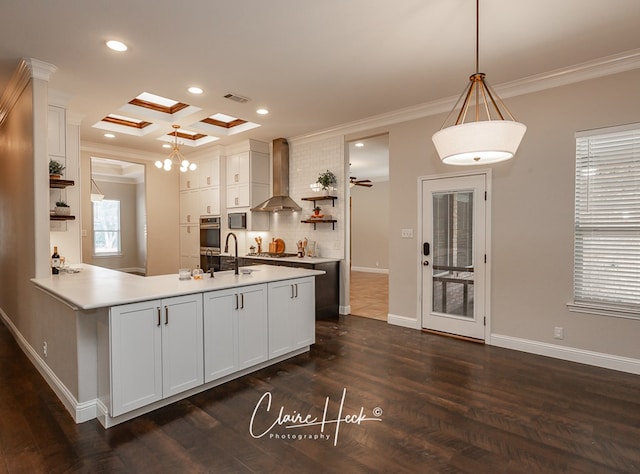 kitchen with crown molding, open shelves, stainless steel appliances, white cabinets, and wall chimney range hood