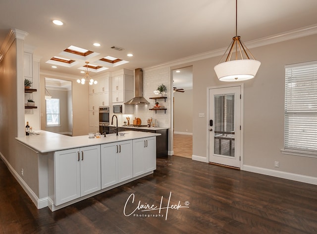 5305 Wimberley Spring Ct, Midland, TX 79707 - kitchen with open shelves, wall chimney range hood, ornamental molding, white cabinetry, and dark wood-style floors