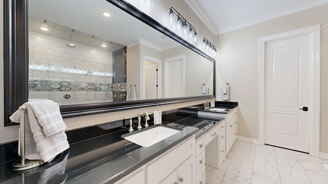 bathroom with vanity, ornamental molding, and tiled shower