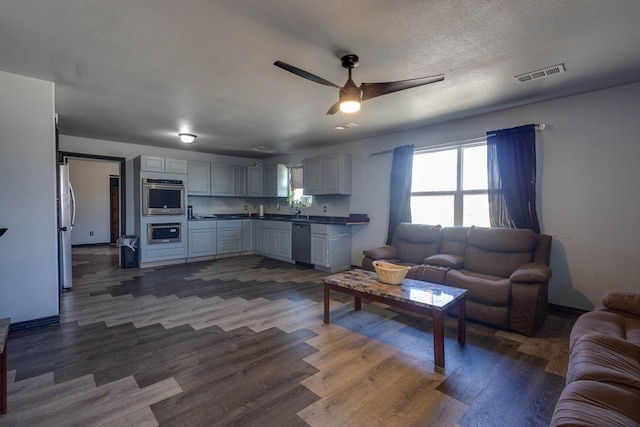 600 NW 8th St, Big Spring, TX 79720 - living room with ceiling fan and dark wood-type flooring
