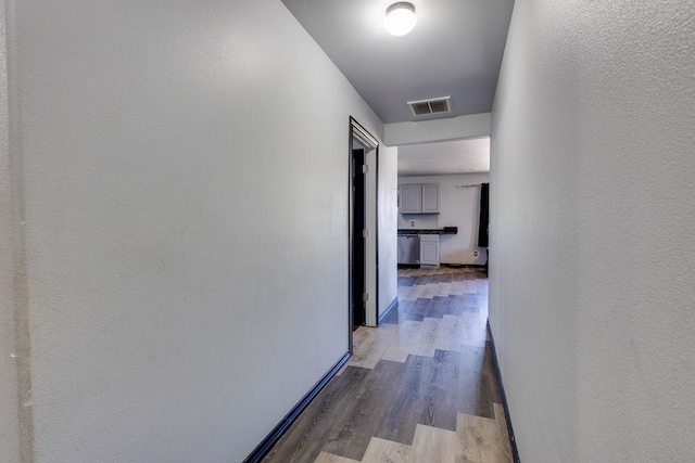600 NW 8th St, Big Spring, TX 79720 - hall featuring wood finished floors and baseboards