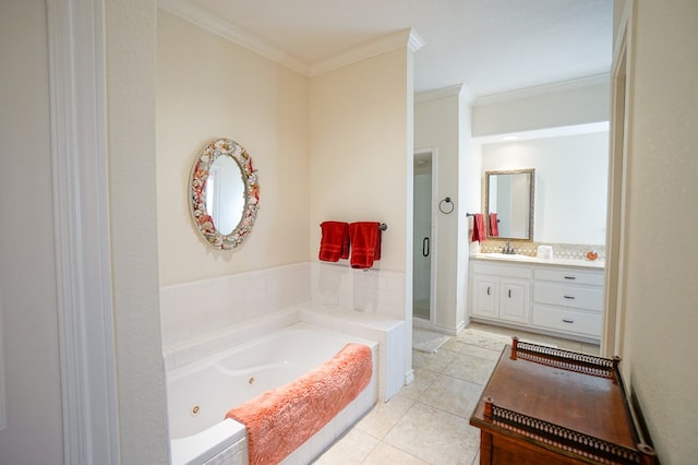 full bath featuring a whirlpool tub, tile patterned flooring, vanity, and crown molding