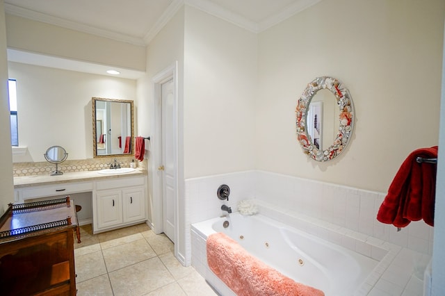 bathroom with a whirlpool tub, ornamental molding, vanity, and tile patterned floors