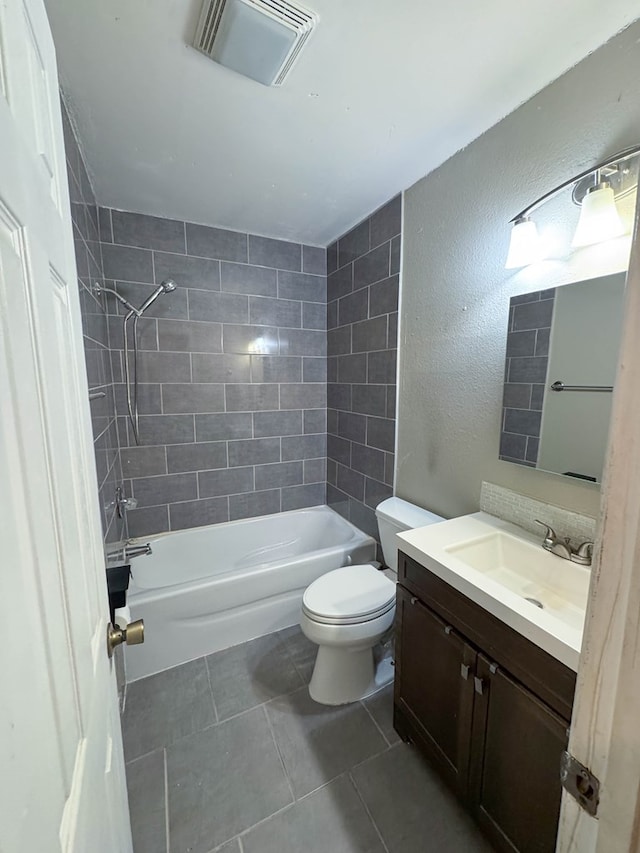 full bath featuring vanity, visible vents, tub / shower combination, tile patterned floors, and toilet