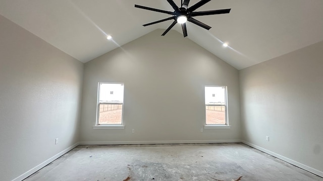 spare room featuring plenty of natural light, ceiling fan, high vaulted ceiling, and baseboards