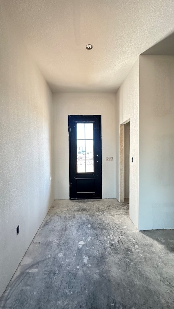 entrance foyer with a textured ceiling