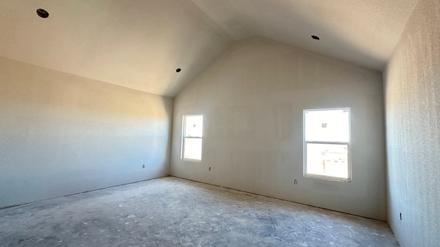 empty room with vaulted ceiling