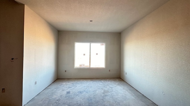 spare room featuring a textured ceiling