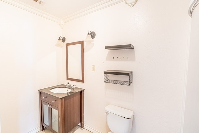 1204 Tinker St, Seagraves, TX 79359 - bathroom with toilet, baseboards, ornamental molding, and vanity
