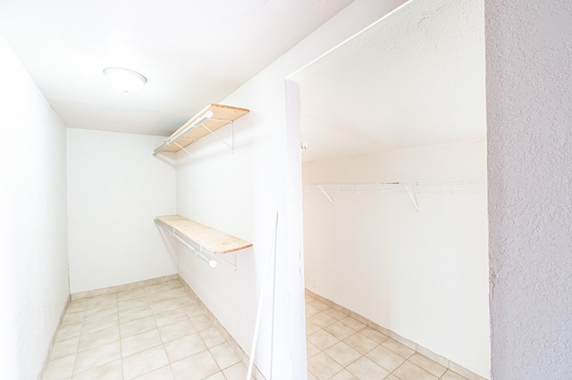 1204 Tinker St, Seagraves, TX 79359 - spacious closet featuring light tile patterned floors