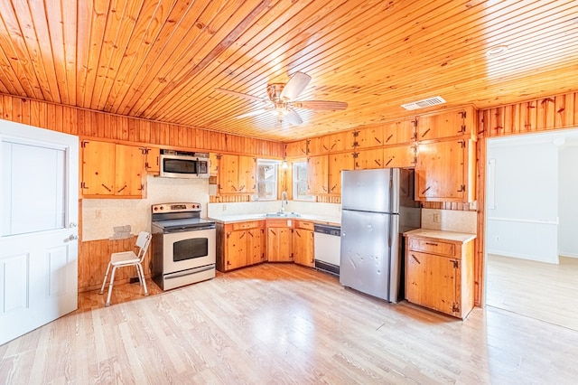 1204 Tinker St, Seagraves, TX 79359 - kitchen with a sink, stainless steel appliances, light countertops, and visible vents
