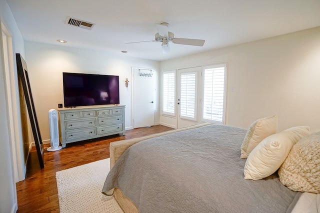 bedroom featuring ceiling fan and dark hardwood / wood-style floors