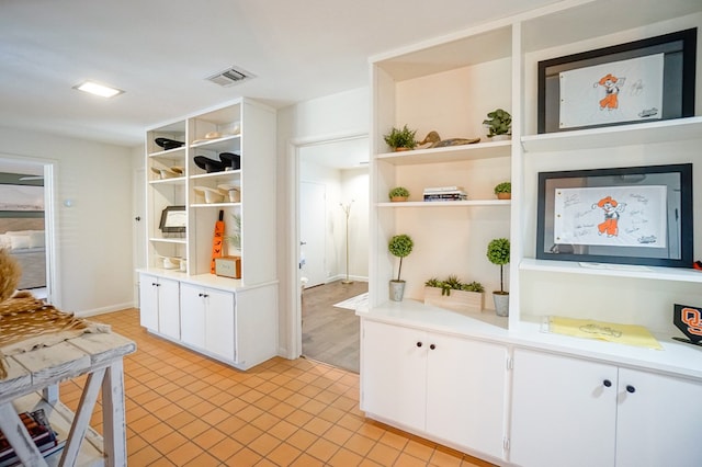 kitchen featuring white cabinetry