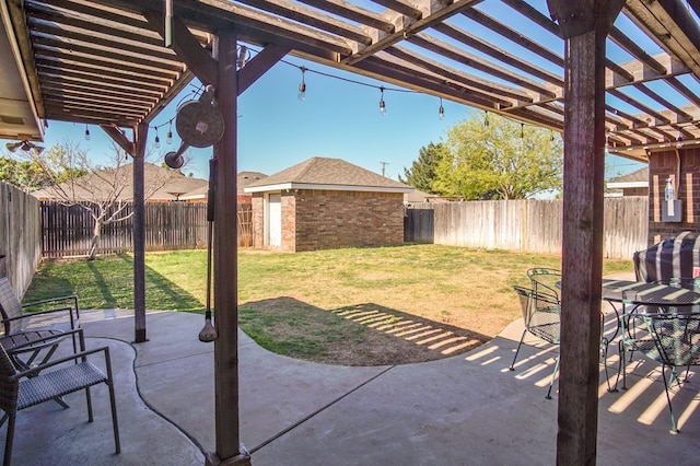 view of patio featuring an outbuilding, a fenced backyard, and a pergola