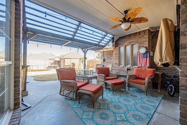 view of patio featuring fence and ceiling fan