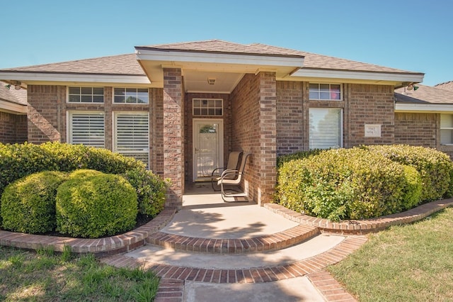 entrance to property with brick siding