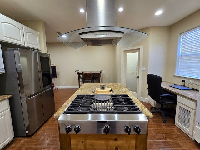 6101 Fm 715, Midland, TX 79706 - kitchen featuring appliances with stainless steel finishes, island range hood, white cabinets, baseboards, and recessed lighting