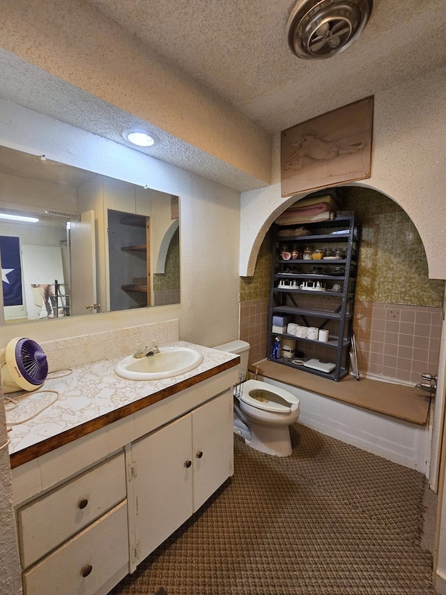 6101 Fm 715, Midland, TX 79706 - bathroom featuring vanity, a textured ceiling, and toilet