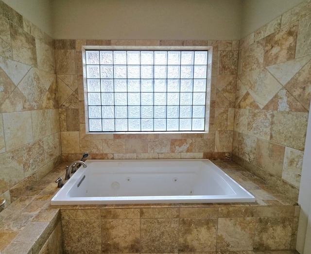 6101 Fm 715, Midland, TX 79706 - bathroom featuring a tub with jets and healthy amount of natural light