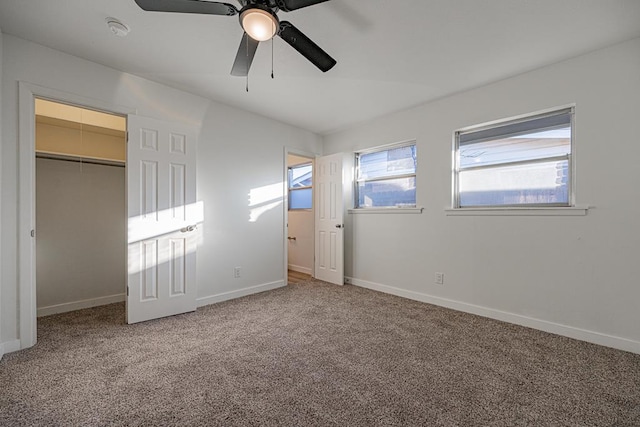 unfurnished bedroom with carpet floors, a closet, and ceiling fan