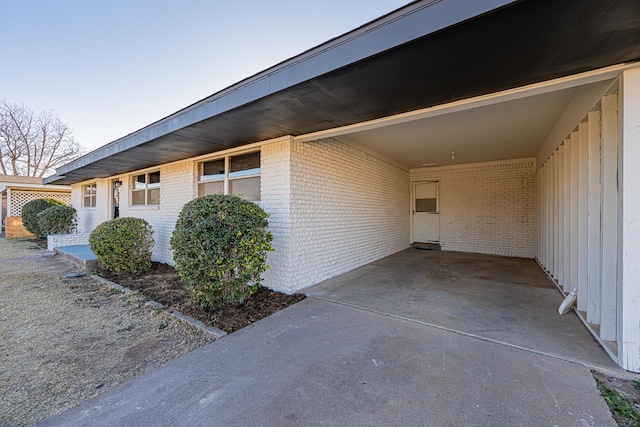 view of property exterior with a carport