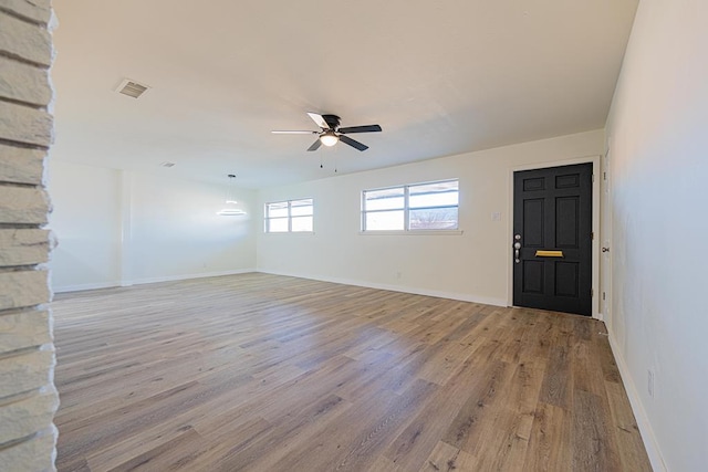 unfurnished room featuring ceiling fan and light hardwood / wood-style flooring