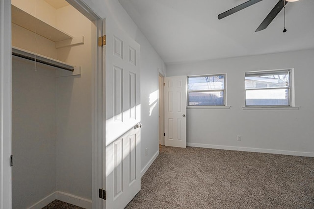 unfurnished bedroom featuring a closet, ceiling fan, and carpet