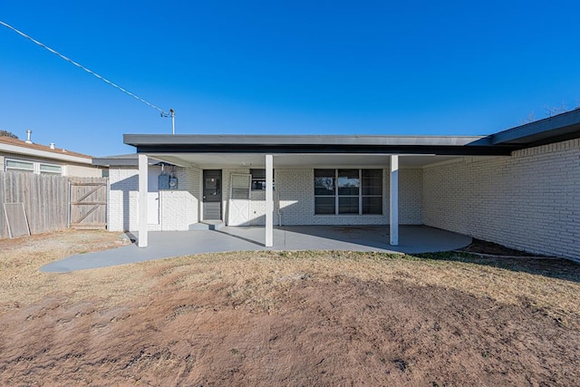 back of house with a patio