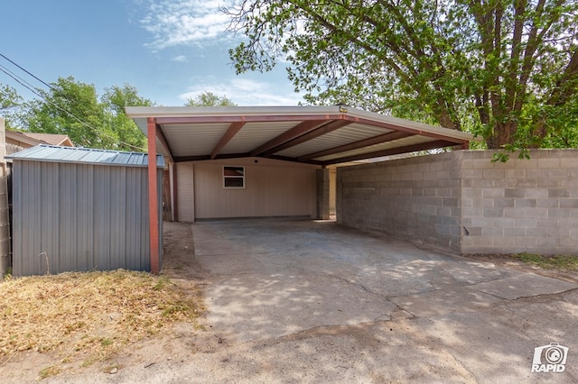 exterior space with a carport and driveway