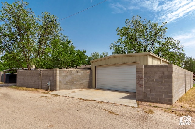 garage featuring fence