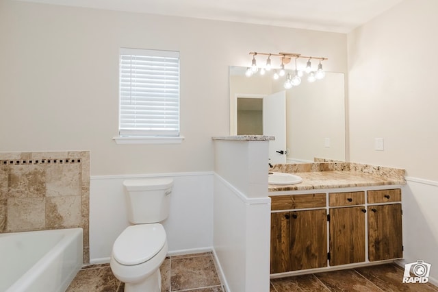 bathroom with a tub to relax in, toilet, and vanity
